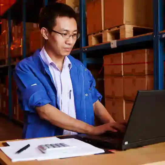 inventory-management Man managing stock and inventory on a laptop using UBS Inventory Software