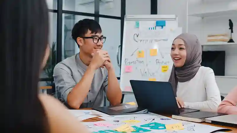Business team reviewing e-Invoicing software on a computer